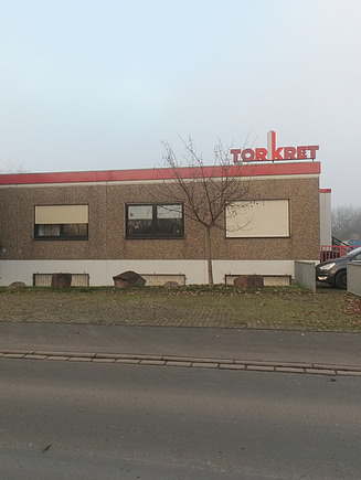 Foto von einem Gebäude mit Torkret Logo